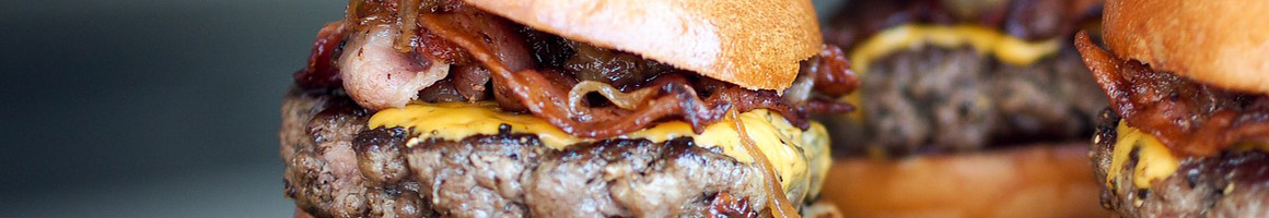 Eating American (New) Burger Sandwich at Big Bun Drive In restaurant in Boise, ID.